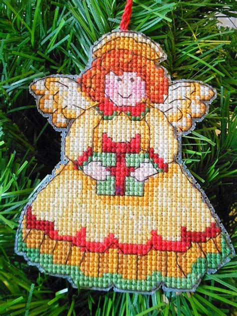 The joy and fun of going to the woods to pick the perfect tree. Dimensions Angel Ornament | Christmas cross stitch, Ornaments