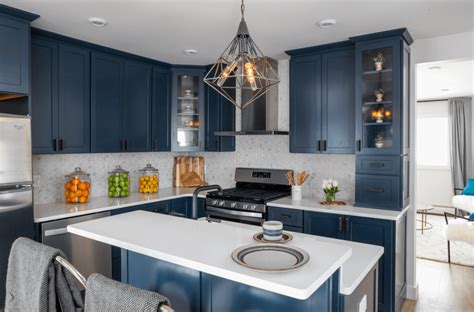 Grey kitchen cabinets are incredibly versatile because grey is a neutral gradient of black, which doesn't have a clashing color. Kitchen Trend: Navy Blue Cabinets - Scott McGillivray