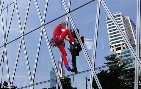 The world's leading free climber; Alain Robert: 'Spiderman' daredevil climber scales 700ft ...