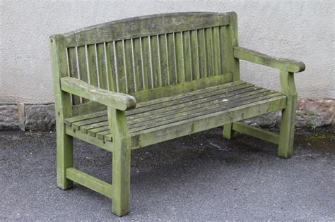 A Teak Slatted Garden Bench With Arched Back Hartleys Auctioneers And Valuers
