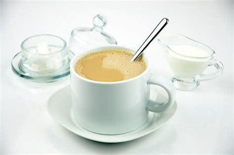 Coffee with cream and sugar would be great. Coffee with Cream and Sugar | Coffee in a white cup served ...