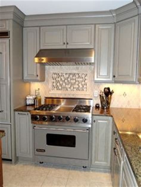 A dark gray can be especially sharp on just a portion of the cabinets such as painting the island or just the lower cabinets that color. Tropic Brown Granite Countertops | Home ideas | Pinterest ...