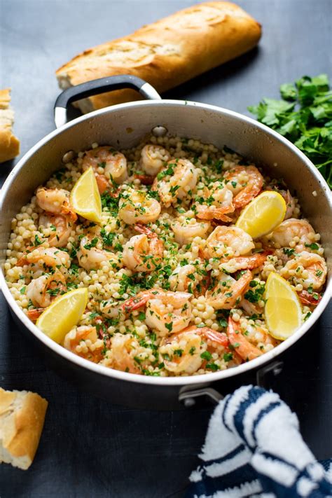 Plump shrimp sautéed in a rich & buttery, bright & lemony, herb & garlicky white wine scampi sauce, and tossed with linguine pasta. Shrimp Scampi Recipe Over Israeli Couscous | Kitchen Swagger