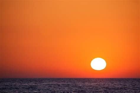 Premium Photo Beautiful Sunset Over The Sea With An Orange Sky
