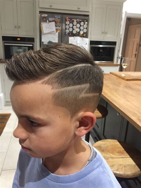 Boys haircuts design are getting huge popularity last few years. Boys haircut with lightning bolt design. #boyshaircut # ...