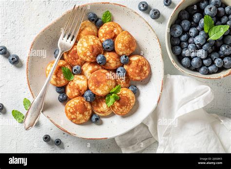 Tasty And Hot Poffertjes With Sweet Fruits Poffertjes With Fruits As