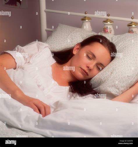 Young Woman Sleeping In Bed Stock Photo Alamy