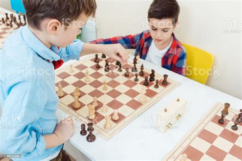 Two Boys Playing Chess In Tournament As Sport Stock Photo Download