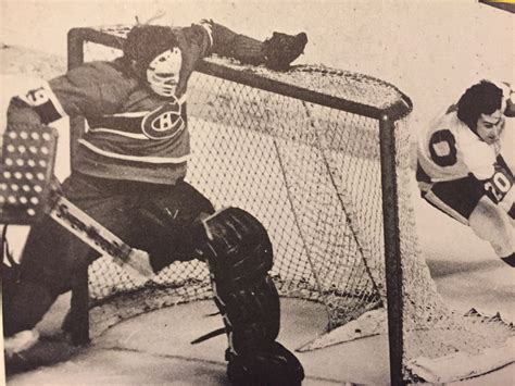 Red Wings forward Mickey Redmond tries to beat Ken Dryden to the post