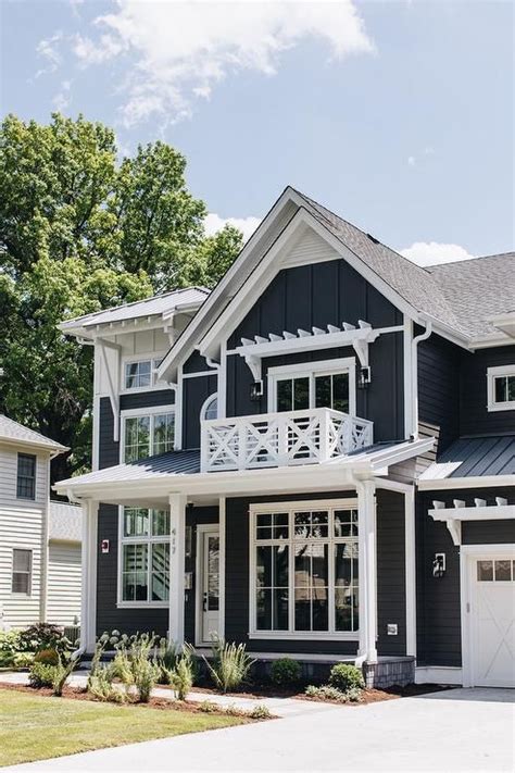 White Trim On A Dark Navy Blue Home Showcases A Stunning Contrast With