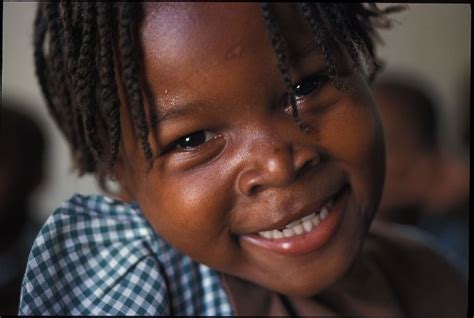 Happy people may refer to: Smiling Haitian Girl | Compassion international, Poverty ...