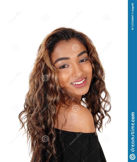 Beautiful Teenager Girl Looking Over Her Shoulder Smiling Stock Image