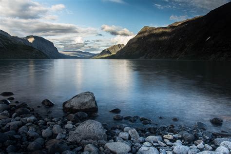 Gray Stones And Calm Body Of Water During Daytime Gjende Hd Wallpaper