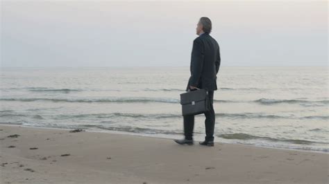 Sad Mature Businessman Walking Alone At The Infinitive Ocean Man