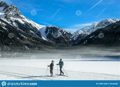 Two Ski Mountaineers Ski On The Anterselva Frozen Lake