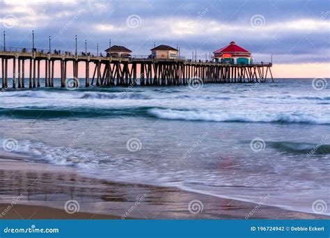 Huntington Beach Pier At Sunset Ocean Waves And Beach Editorial