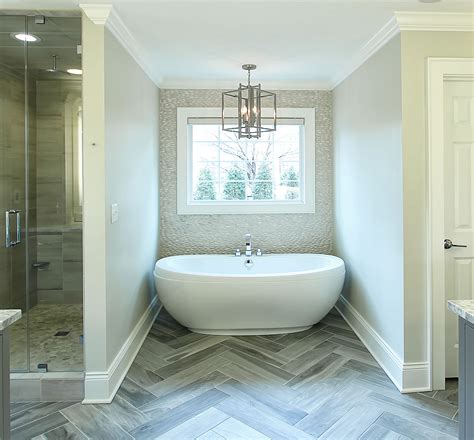 Master-Bath-Herringbone-floor-tile-pebble-backsplash-Large-tub