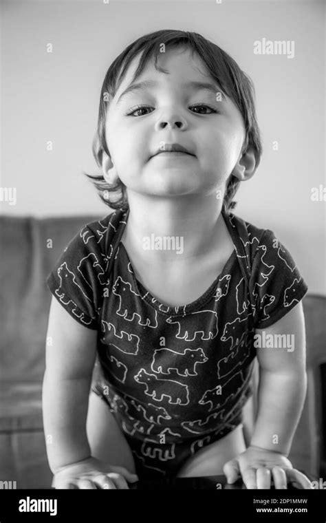 Portrait Of Cute Baby Boy Standing At Home Stock Photo Alamy