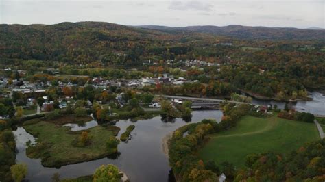 6k Aerial Video Flying Over Ammonoosuc River By Rural Town Bath