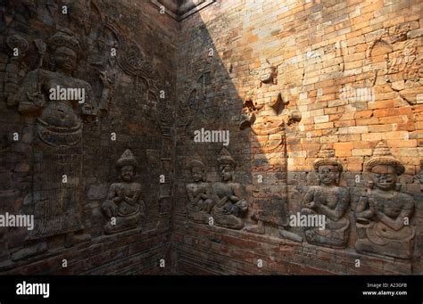 Angkor Wat Temple Carvings On A Brick Wall Cambodia Asia Stock Photo