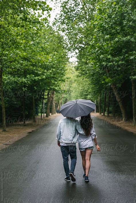 Couple Walking Together Under The Rain By Simon Rain Couple