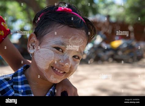 Portrait Of A Girl With Paste Made Out Of The Thanaka Tree On Her Face