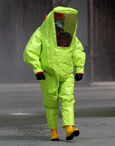 Rescuer With The Yellow Suit Against Biological Hazard From Cont