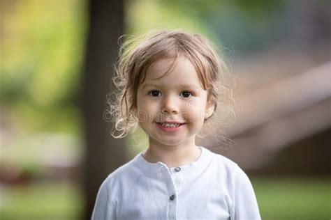 Portrait Of Cheerful Little Girl Outdoors Stock Photo Image Of