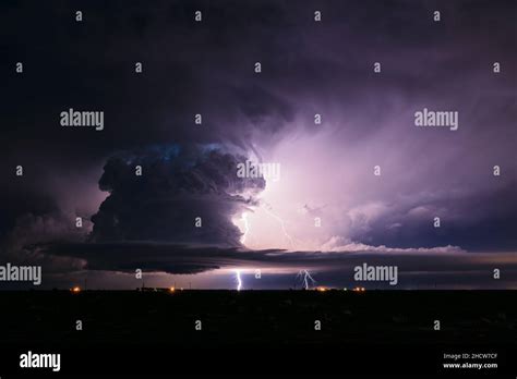 Supercell Thunderstorm Cumulonimbus Cloud Illuminated By Lightning