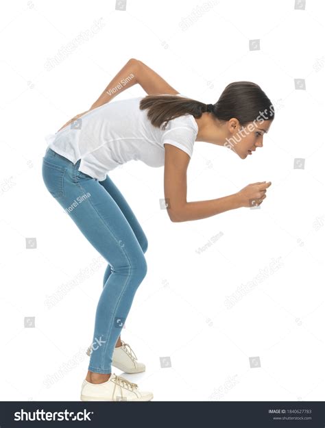 Side View Curious Casual Woman Bending Stock Photo