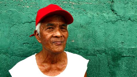A Matured Filipino Man Stands Against A Green Wall Editorial Stock Image Image Of Head Hair