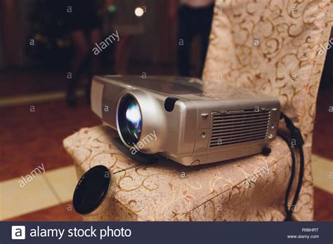 Closeup Of Projector For Presentation In Blue Light Tone Stock Photo