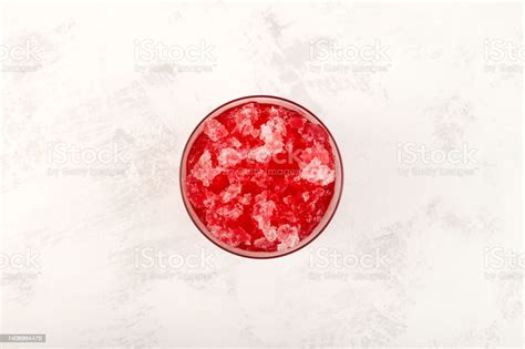 Slushie Drink With Cherry Sweet Shaved Ice In Disposable Plastic Cup
