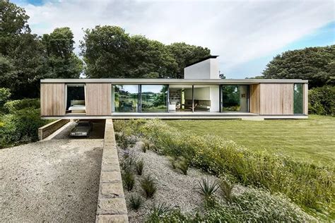 Modern House Cantilevers Over Stone Wall In England Modern House Stone Wall House