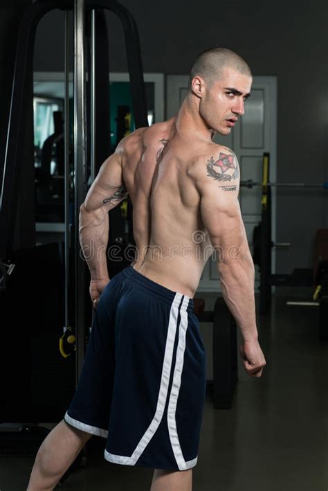 Muscular Man Flexing Triceps In Gym Stock Image Image Of Biceps
