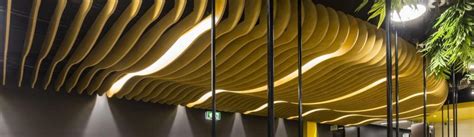 Wave Blades Ceiling Features And Decorative Screens Define Areas Of