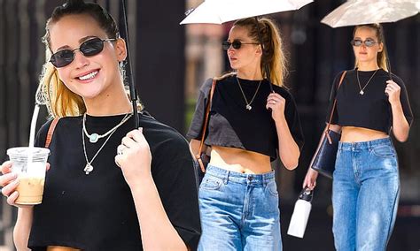 Jennifer Lawrence Flashes Her Toned Midriff In A Crop Top As She Goes