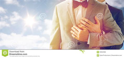 Close Up Of Male Gay Couple With Wedding Rings On Stock