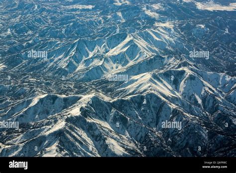 An Aerial View Of Snowy Mountains Stock Photo Alamy