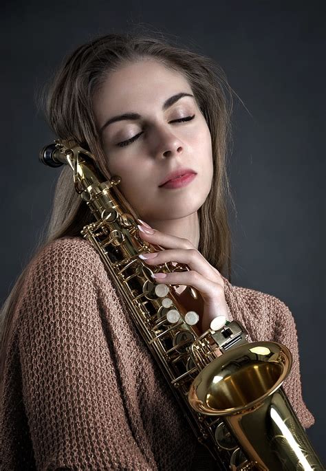 Royalty Free Photo Woman Holding Brass Colored Saxophone PickPik