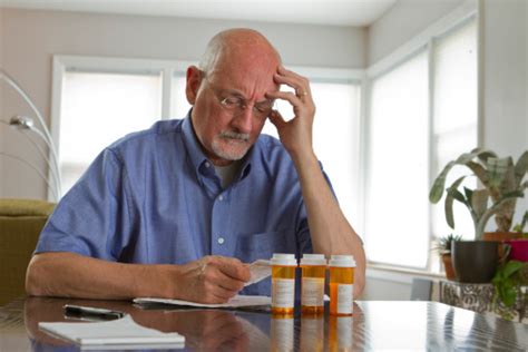 Older Man With Prescription Medications Stock Photo Download Image