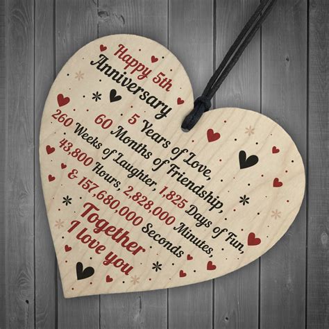 Get her a present that's been made with the traditional material for fifth anniversaries, wood. 5th Wedding Anniversary Gift For Him Her Wood Heart Keepsake