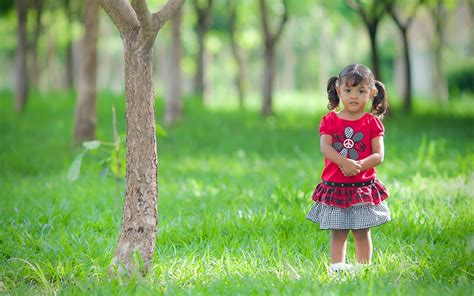 Beautiful Cute Little Girl Child Standing Silently In Garden Photos