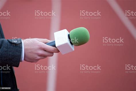 Reporter Holding Microphone For Interview Stock Photo Download Image