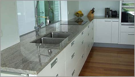 Kashmir gold granite with white cabinets. KASHMIR | KASHMIR WHITE GRANITE | Granite Countertops
