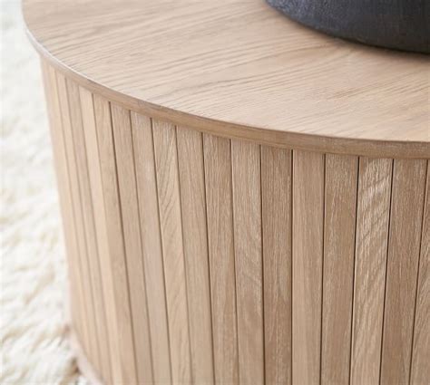 The splayed leg design in light wood gives shape and height to the overall design. Arlo 31" Tambour Round Storage Coffee Table | Coffee table ...
