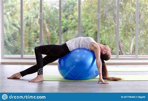 Caucasian Woman Exercising With Exercise Ball Fitness Girls Flexing