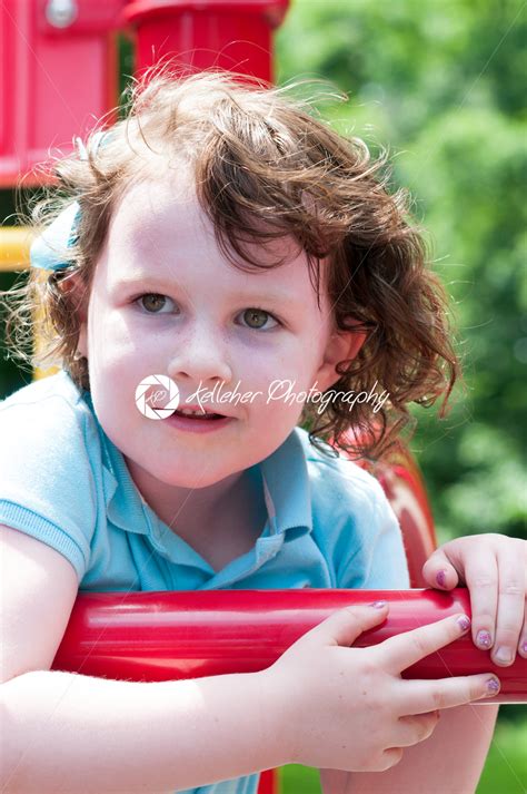 Young Girl Having Fun Outside At Park On A Playground Swing Set Kelleher Photography Store