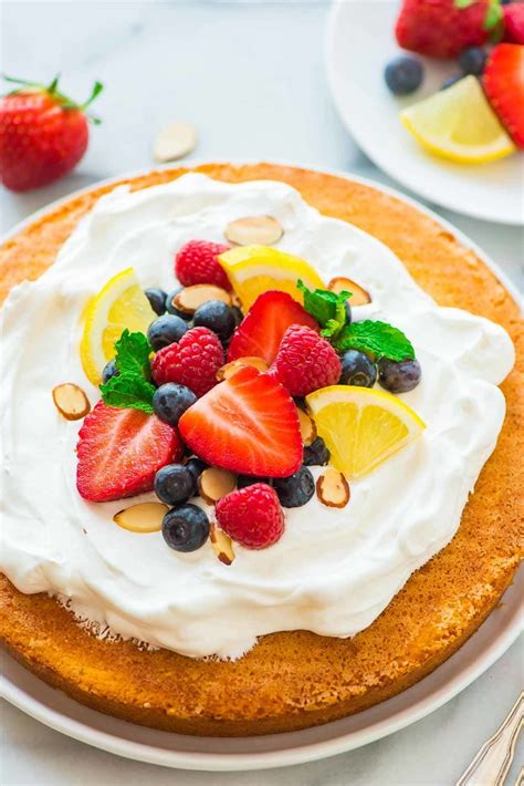 It's baked until puffed up and golden brown then topped with a drizzle. Flourless Lemon Almond Cake with Fresh Berries - a light ...
