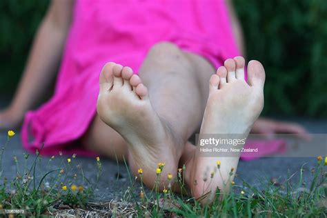 Young Girl Sitting Bare Feet Photo Getty Images